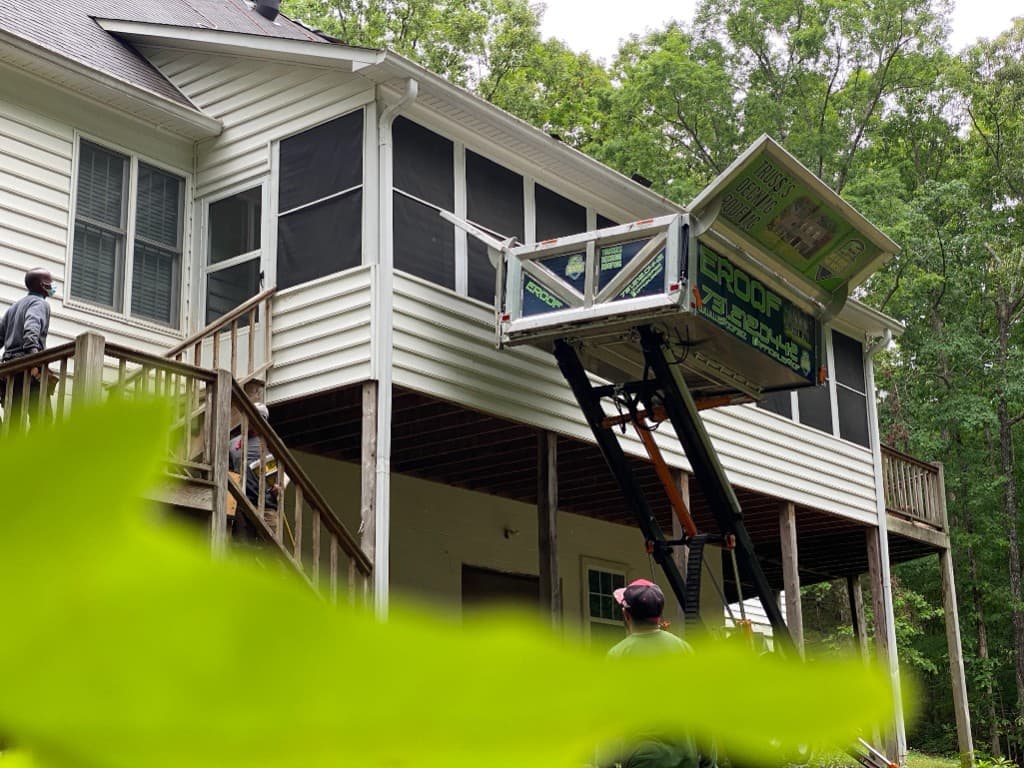 eRoof lift reaching a second-story deck roof